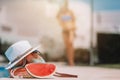 Colorful beach bag, glass of juice, straw hat and airplane model Royalty Free Stock Photo