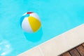 Colorful Beach Ball Floating on a swimming pool Royalty Free Stock Photo