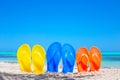 Colorful beach flip flops sandals on the beach Royalty Free Stock Photo
