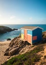 Colorful Beach Hut on Rocky Coastline Royalty Free Stock Photo