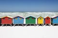 Colorful Beach Huts On White Sandy Beach