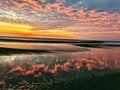 Colorful Beach sunrise in NC OBX water reflection Royalty Free Stock Photo