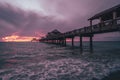 Colorful beach sunset across a pier in Clearwater, Florida Royalty Free Stock Photo