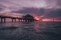 Colorful beach sunset across a pier in Clearwater, Florida Royalty Free Stock Photo