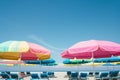 colorful beach umbrellas and loungers setup Royalty Free Stock Photo