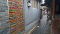 Colorful beaded curtain door in a traditional Chinese hutong.