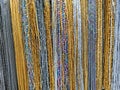 Colorful beads hanging in rows on the wall Royalty Free Stock Photo