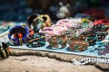 Colorful Beadwork on a cracked stone surface with a shallow depth of field