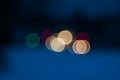 Colorful beautiful blurred bokeh background with copy space. Festive texture. Brilliant multicolored light spots on a dark blue
