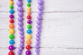 Colorful beautiful bright beads necklace on a wooden background Royalty Free Stock Photo