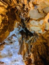Colorful beautiful cave interior with ancient stalactites and stalagmites. Wild nature Royalty Free Stock Photo