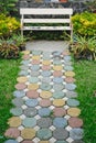 Colorful and beautiful cement blocks in walkway with white chair Royalty Free Stock Photo