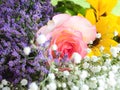 Colorful beautiful spring bouquet closeup. Roses, sunflower, purple flowers