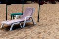 Colorful beds and umbrella on a tropical beach Royalty Free Stock Photo