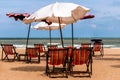 Colorful beds and umbrella on a tropical beach Royalty Free Stock Photo