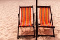 Colorful beds and umbrella on a tropical beach Royalty Free Stock Photo