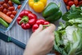 Fresh and colorful bell peppers and other vegetables on wooden table Royalty Free Stock Photo