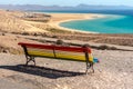 Colorful bench to contemplate View in Playa de Sotavento, Fuerteventura in Spain in summer