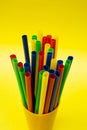 Colorful Beverage Straws Grouped in Yellow Cup with Isolated Background Royalty Free Stock Photo