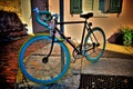 Colorful Bicycle Locked to a Post