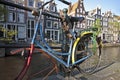 Colorful bike against a bridge Amsterdam Holland Royalty Free Stock Photo