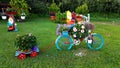 colorful bike with flowers in a garden