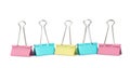 Colorful binder clips on white. Stationery item Royalty Free Stock Photo