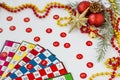 Colorful bingo game cards and numbers on white background with christmas ornaments Royalty Free Stock Photo