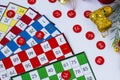 Colorful bingo game cards and numbers on white background with christmas ornaments Royalty Free Stock Photo