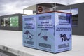 Colorful bins at Hobart airport with animal pictograms and warnings to drive slow and carefu Royalty Free Stock Photo