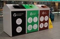 Colorful bins for waste segregation in Food Court in Dublin Airport. Royalty Free Stock Photo