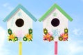 Colorful bird house in sky background Royalty Free Stock Photo