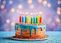 Colorful birthday cake with lit colored candles. Royalty Free Stock Photo