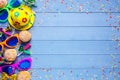 Colorful birthday or carnival border with party items on wooden background Royalty Free Stock Photo