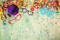 Colorful birthday or carnival frame with party items on wooden background. Royalty Free Stock Photo