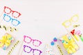 Colorful birthday party accessories on white. Wrapped gifts, confetti, balloons, party hats, decorations, copy space Royalty Free Stock Photo
