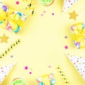 Colorful birthday party accessories on yellow. Wrapped gifts, confetti, balloons, party hats, decorations, copy space Royalty Free Stock Photo