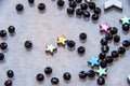 Colorful, black beads and stones isolated grey background