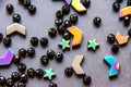 Colorful, black beads and stones isolated on grey background