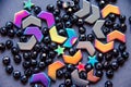 Colorful, black beads and stones on grey background