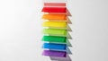 Colorful blocks stacked in a rainbow order against a white background Royalty Free Stock Photo