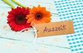 Colorful blossoms and card with german word, Auszeit, means relax or timeout Royalty Free Stock Photo