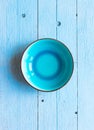 Colorful Blue dish over a light blue painted wood table