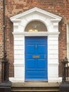 Colorful blue door in old Dublin, Ireland. Entrance to Georgian style buildings in high value property area of the capital