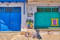 Colorful blue, green boat garage doors, Klima fishermen village, Greece. Painted and weathered wooden doorways Royalty Free Stock Photo