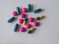 colorful blue green yellow and pink pills pain killers and antibiotic capsule Royalty Free Stock Photo