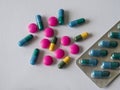 colorful blue green yellow and pink pills pain killers and antibiotic capsule Royalty Free Stock Photo