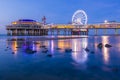 Colorful blue hour sunset on coastline, beach, pier and ferris wheel, Scheveningen, the Hague Royalty Free Stock Photo