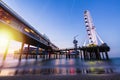 Colorful blue hour sunset on coastline, beach, pier and ferris wheel, Scheveningen, the Hague Royalty Free Stock Photo