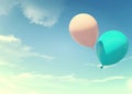 Colorful blue and pink balloons floating in summer holidays in pastel color filter, concept of summer, holidays, and joyful Royalty Free Stock Photo